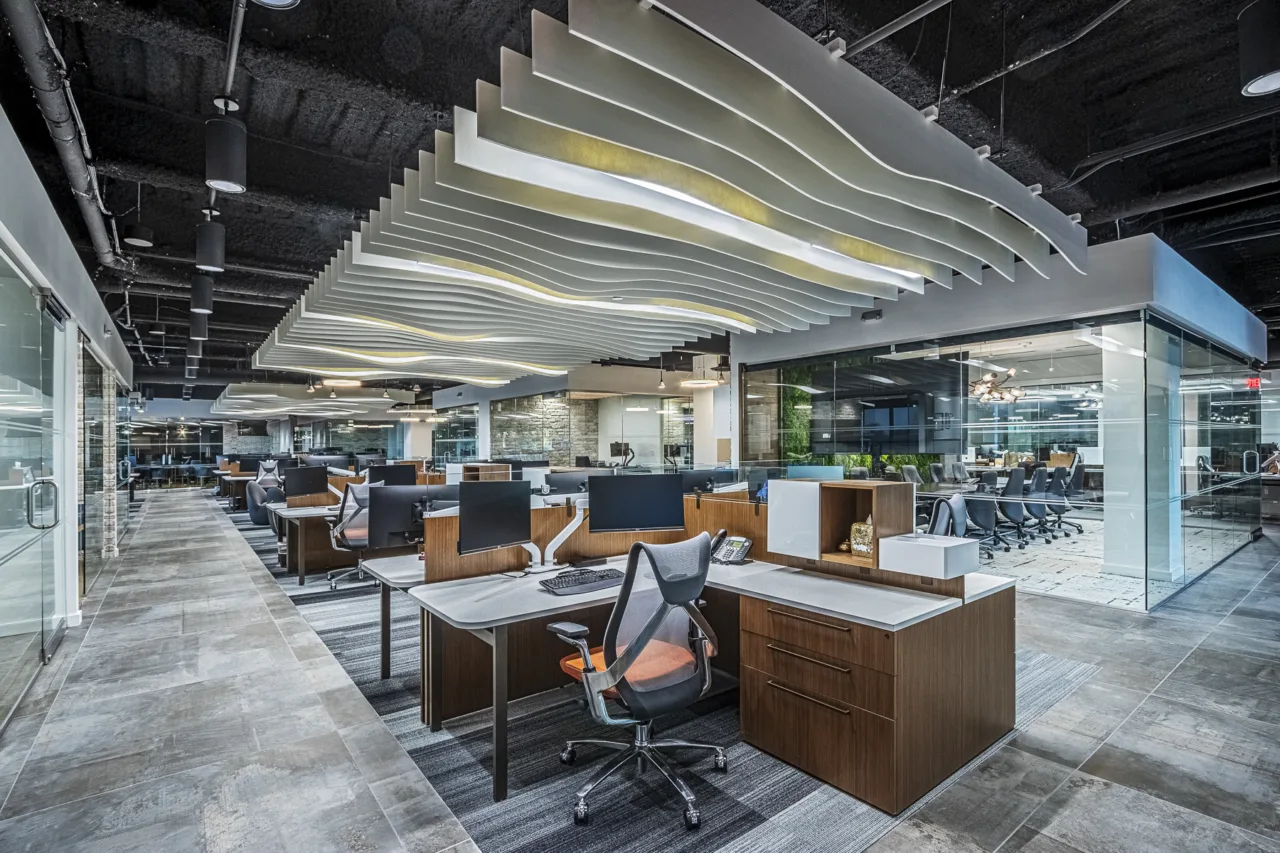 IMI headquarters in Florida, with sculptural ceiling baffles, daylight, workstations and glass meeting rooms