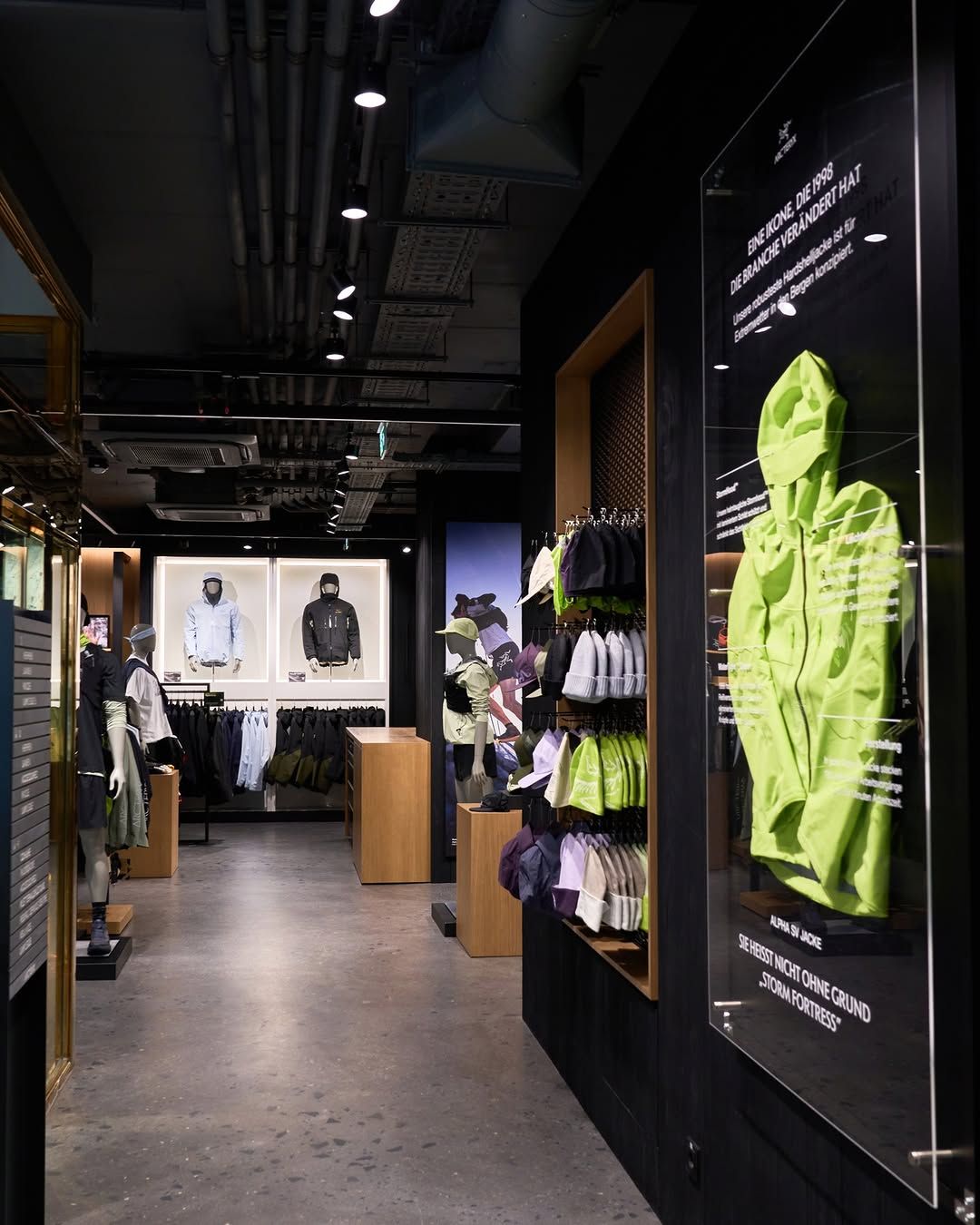 Product displays and timber fixtures inside the completed Arc’teryx Vienna store
