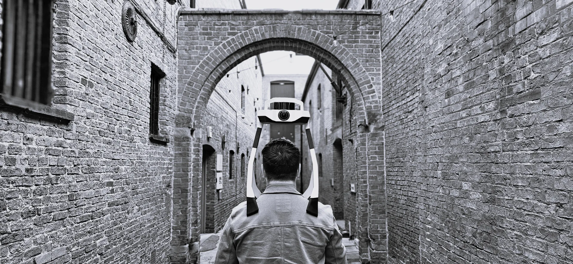 A surveying team member using mobile laser scanning equipment