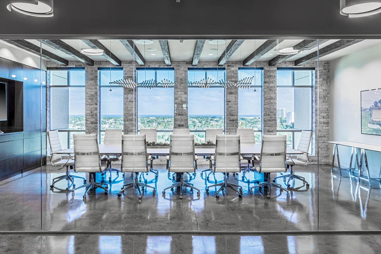 E5 Pharma meeting room with a long table, timber beams and city views