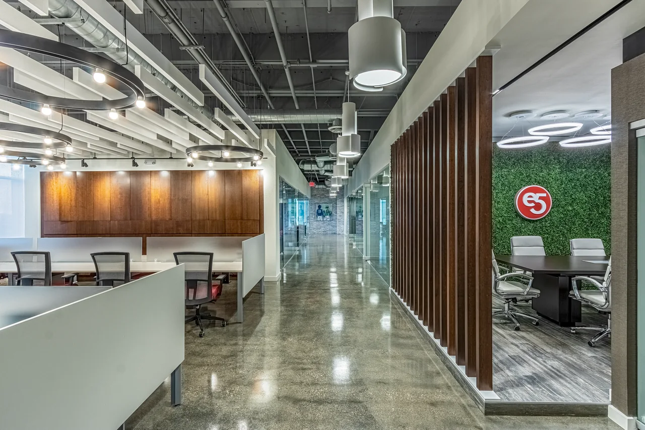 Open workstations, glass meeting rooms and timber partitions at E5 Pharma