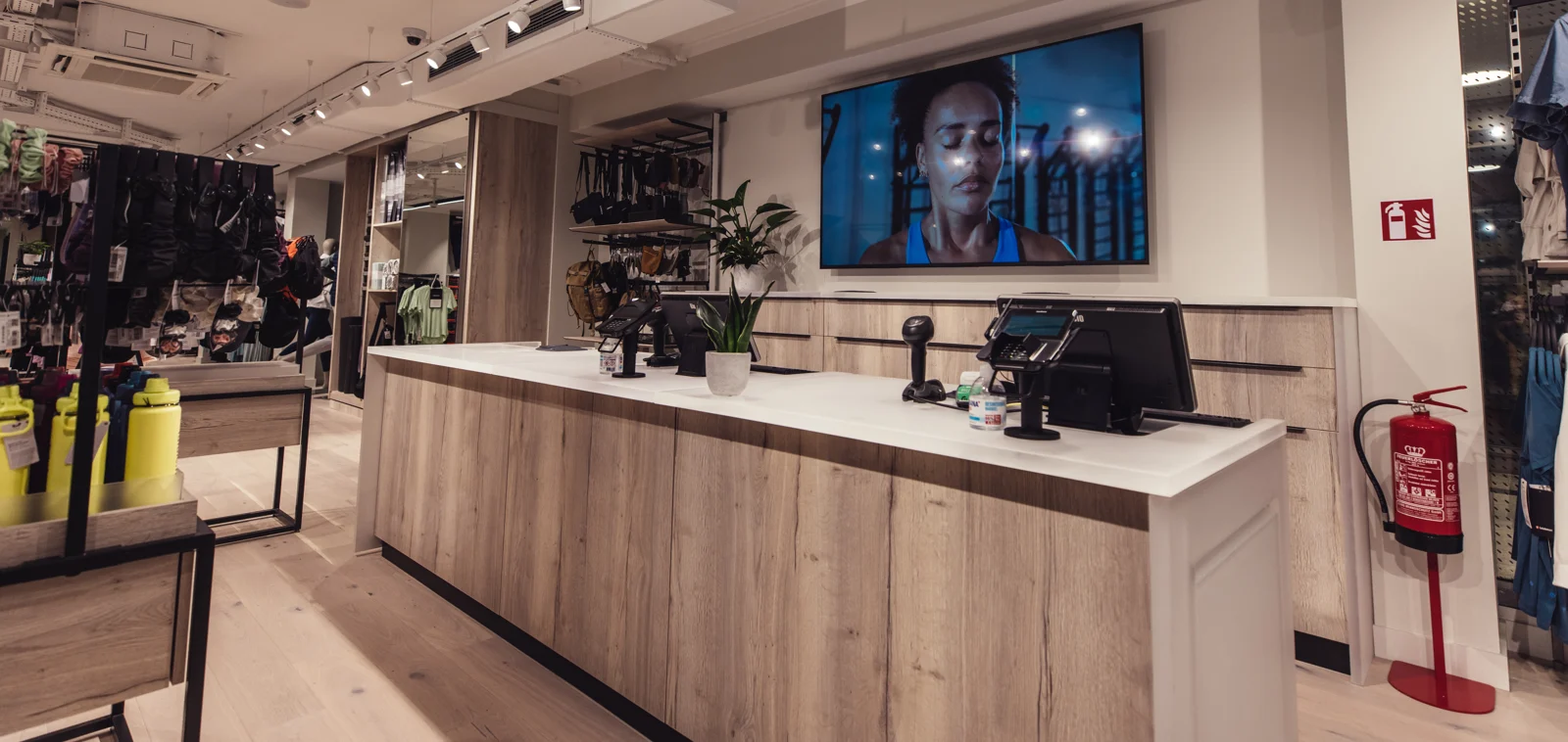 Completed lululemon store interior with timber retail fixtures, counter and brand display