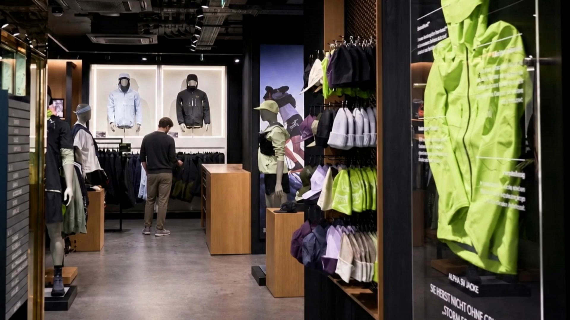 Arc’teryx Vienna retail interior with a customer browsing