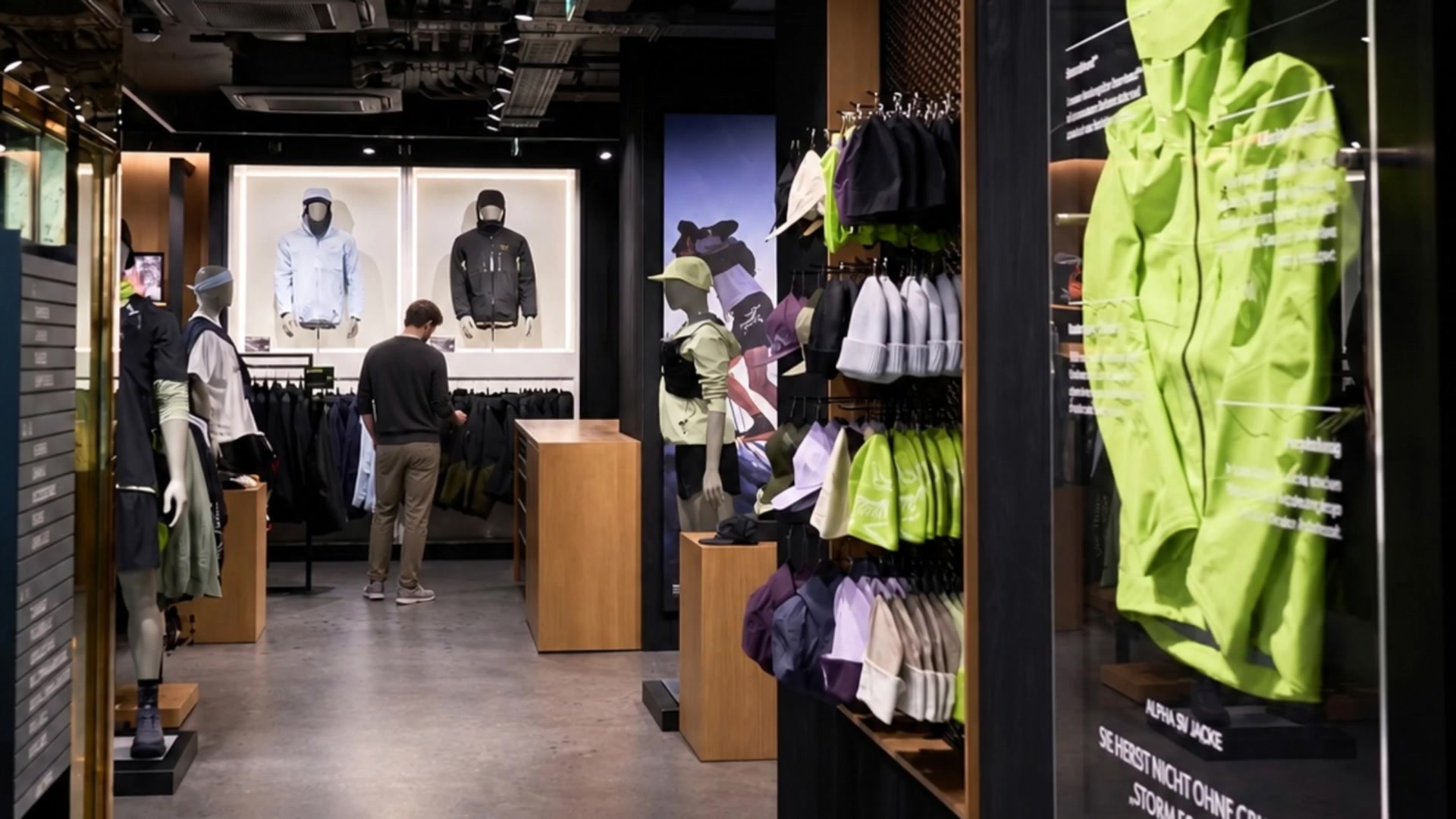 Arc’teryx Vienna retail interior with a customer browsing