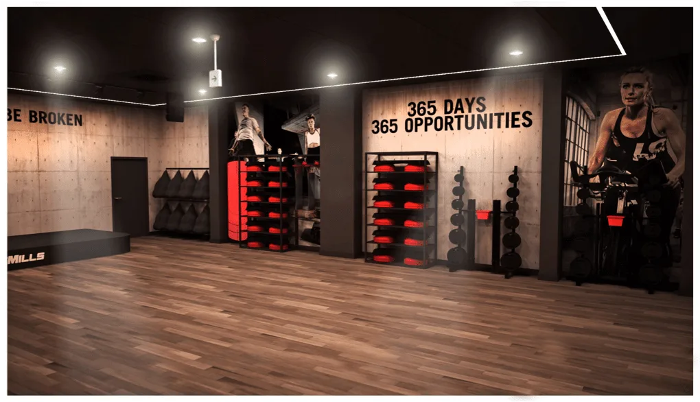Les Mills training studio with equipment racks and wall graphics